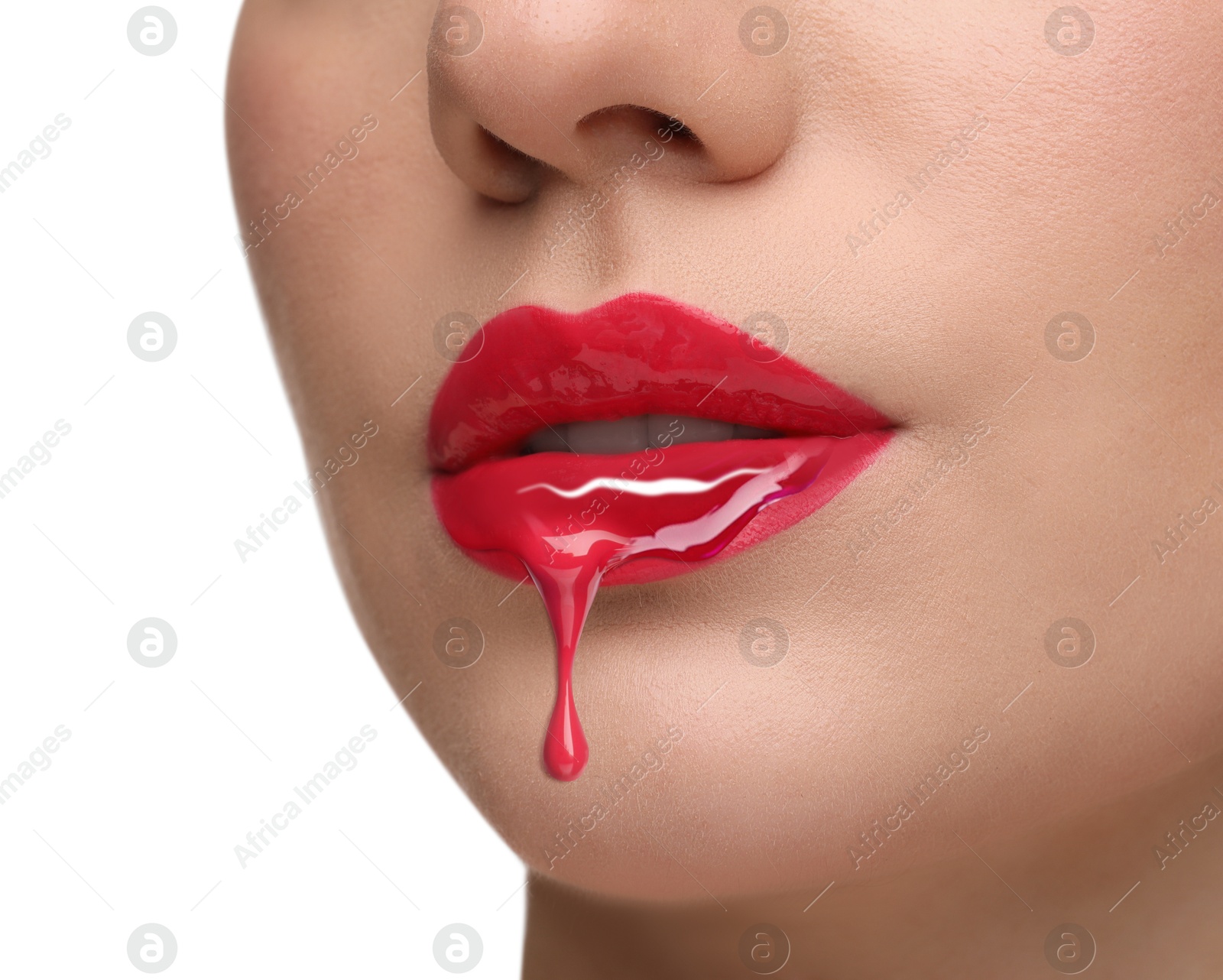 Image of Red liquid lipstick dripping from woman's lip against white background, closeup