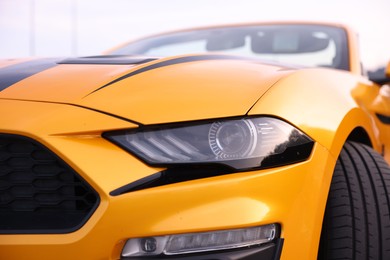 Photo of Closeup view of modern bright cabriolet outdoors