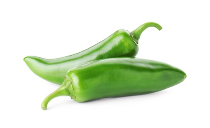 Photo of Two green jalapeno peppers isolated on white