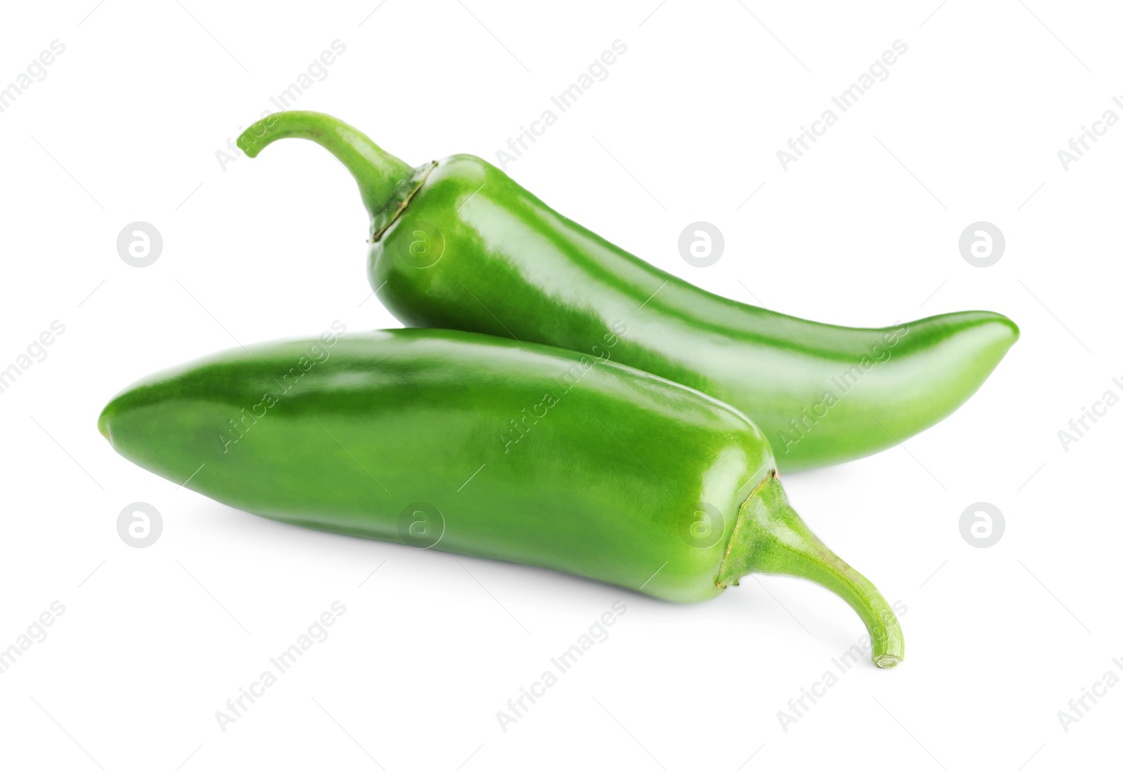 Photo of Two green jalapeno peppers isolated on white