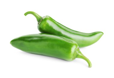 Photo of Two green jalapeno peppers isolated on white