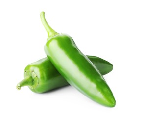 Photo of Two green jalapeno peppers isolated on white