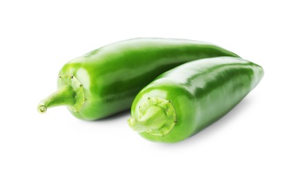 Photo of Two green jalapeno peppers isolated on white