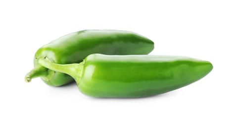 Photo of Two green jalapeno peppers isolated on white