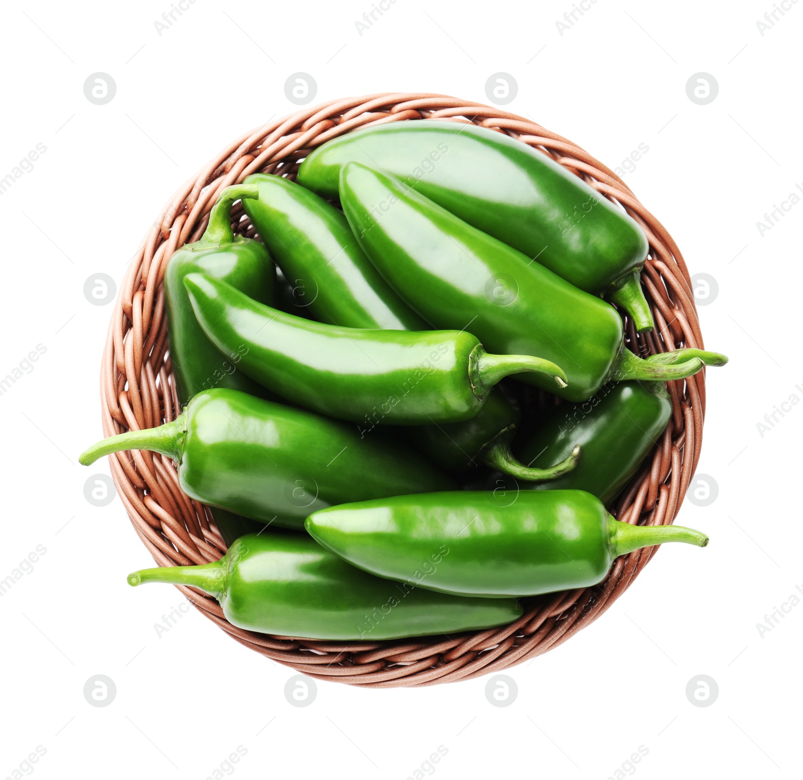 Photo of Green jalapeno peppers in basket isolated on white, top view
