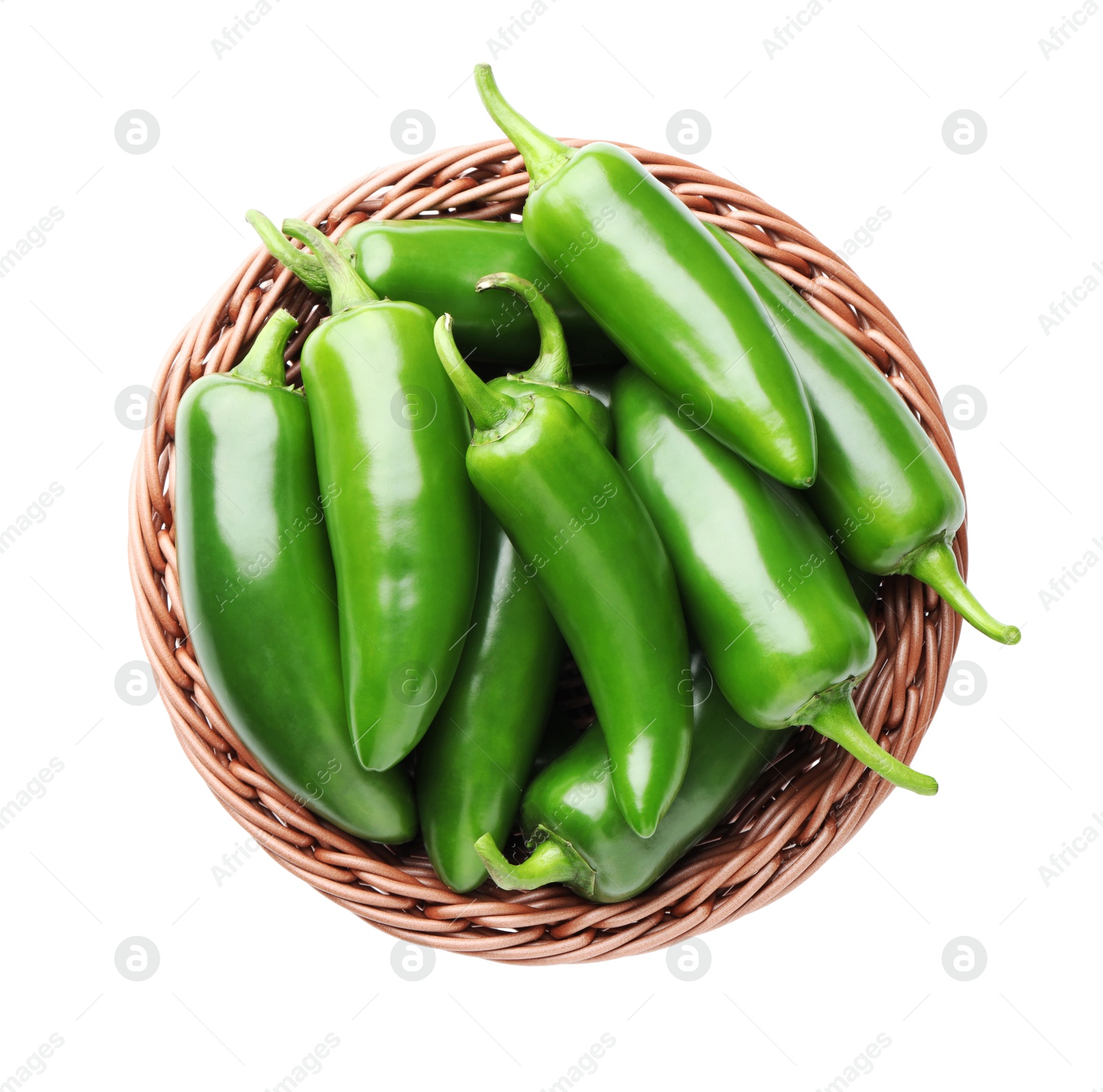 Photo of Green jalapeno peppers in basket isolated on white, top view