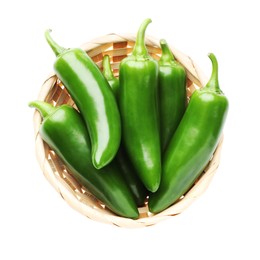 Photo of Green jalapeno peppers in basket isolated on white, top view