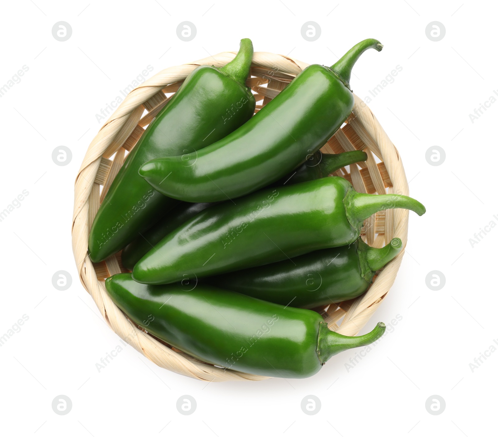 Photo of Green jalapeno peppers in basket isolated on white, top view