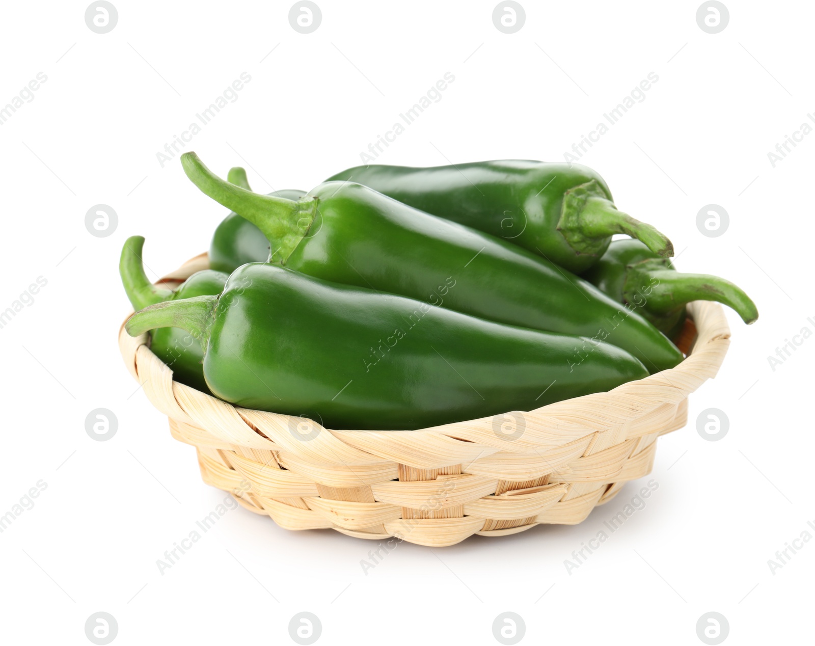 Photo of Green jalapeno peppers in basket isolated on white