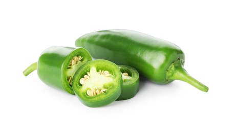 Photo of Pieces of green jalapeno pepper isolated on white