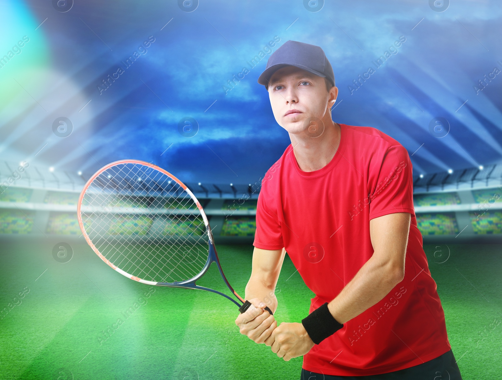 Image of Man with racket playing tennis at stadium