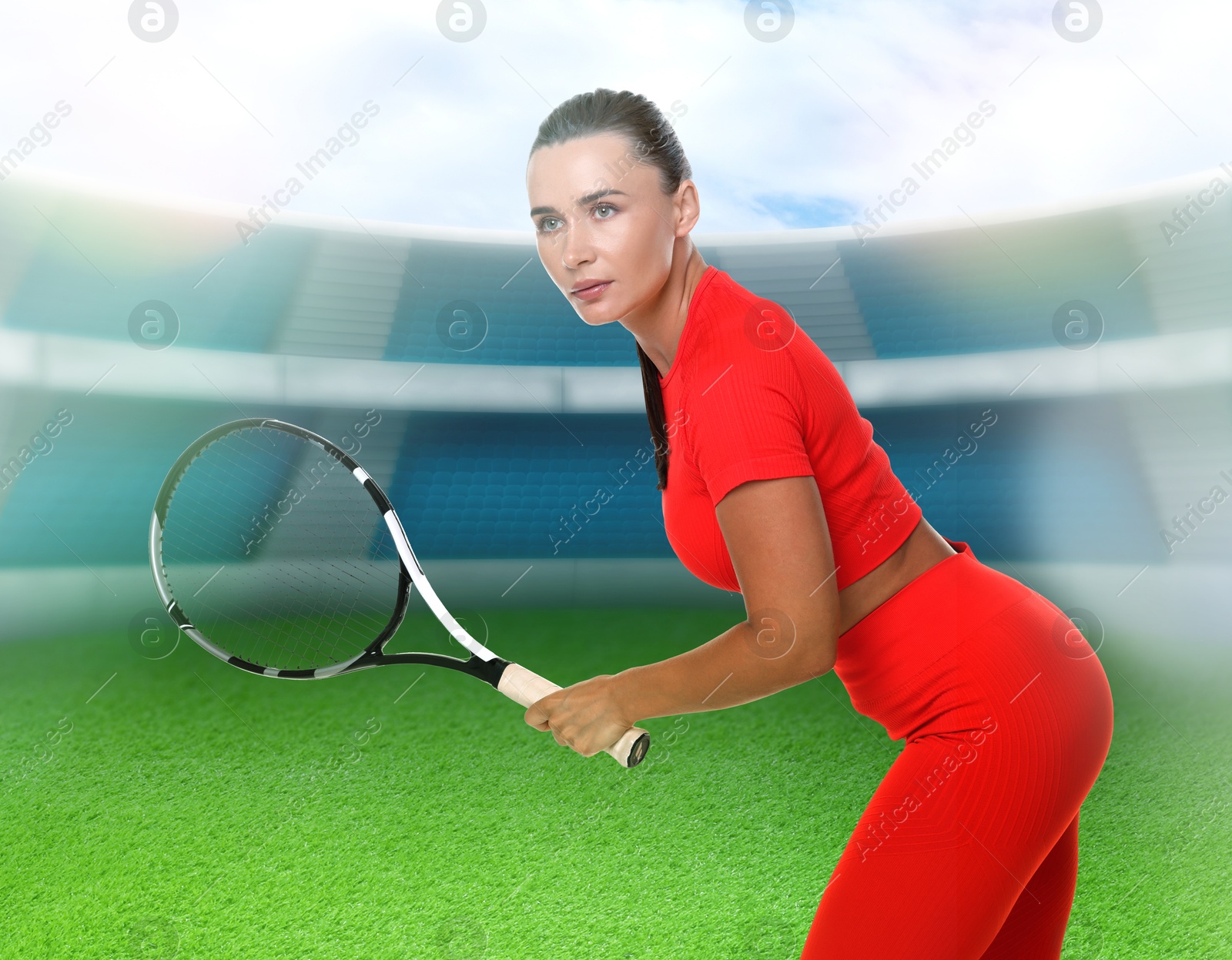 Image of Woman with racket playing tennis at stadium
