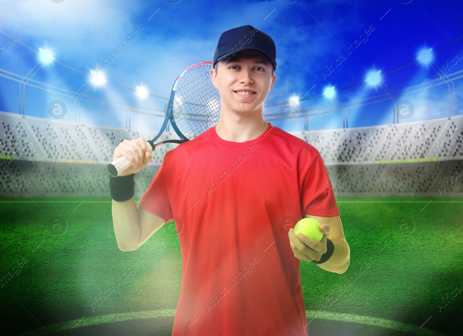 Image of Man with tennis racket and ball at stadium