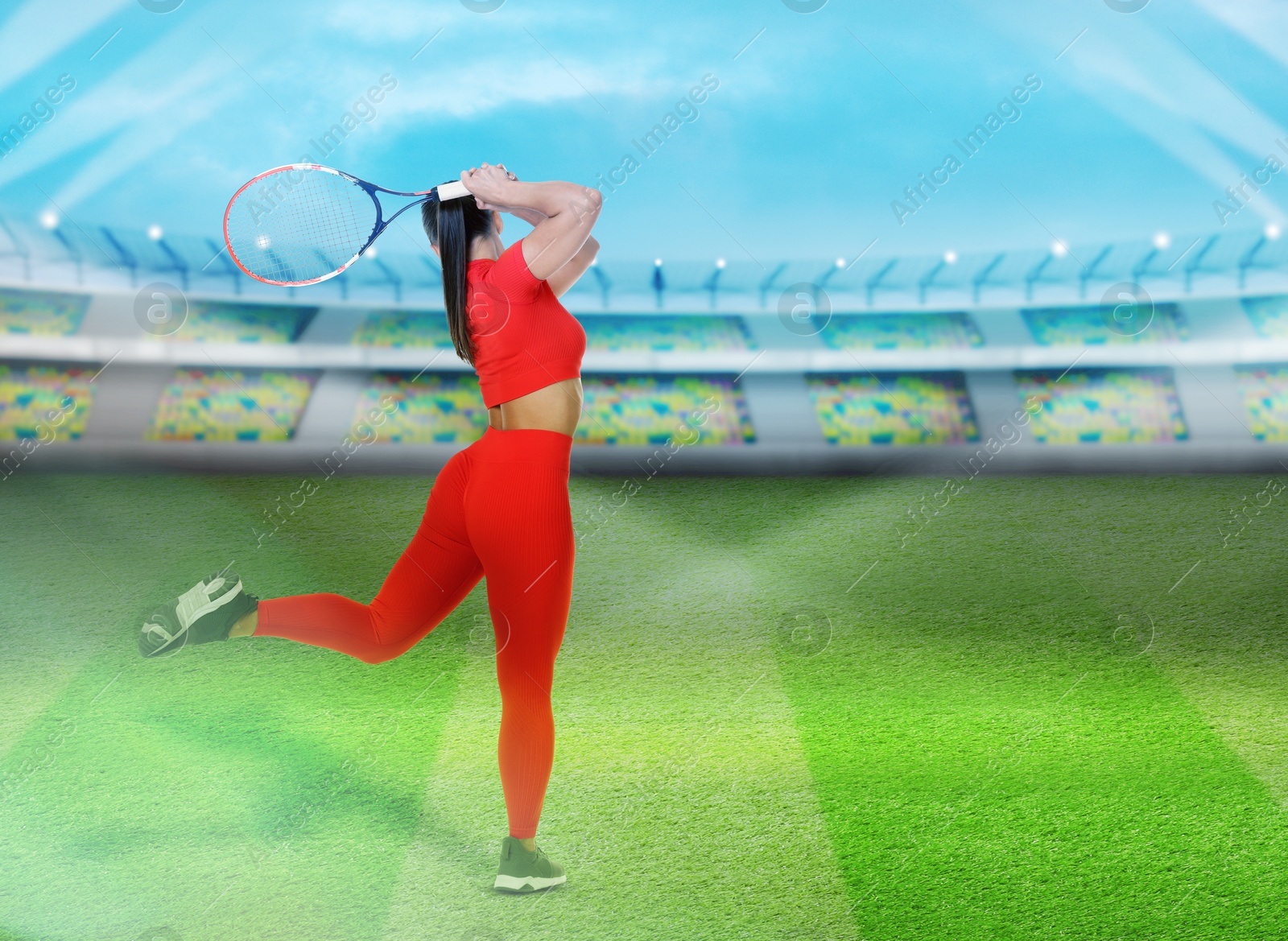 Image of Woman with racket playing tennis at stadium