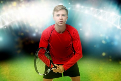Image of Man with racket playing tennis at stadium