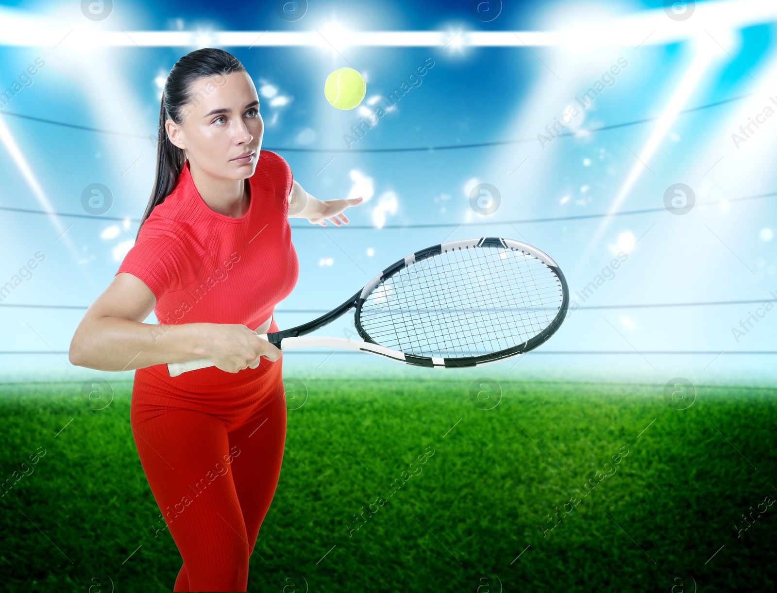 Image of Woman in red sportswear playing tennis at stadium