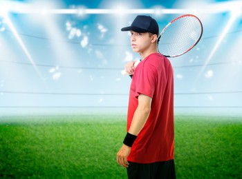 Image of Man with racket playing tennis at stadium