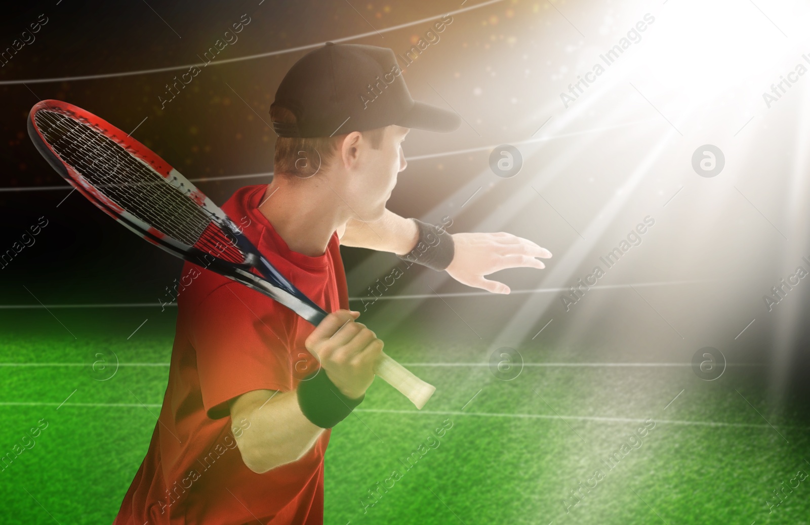 Image of Man with racket playing tennis at stadium