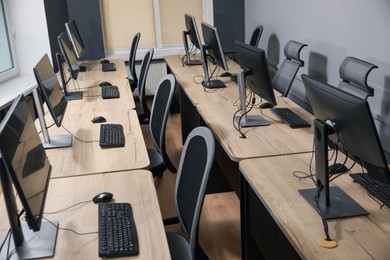 Photo of Many modern computers in open space office
