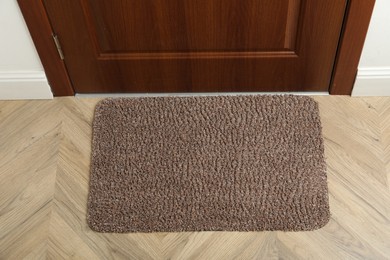 Photo of New clean rectangle mat near entrance door