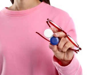 Photo of Woman choosing between glasses and contact lenses on white background, closeup