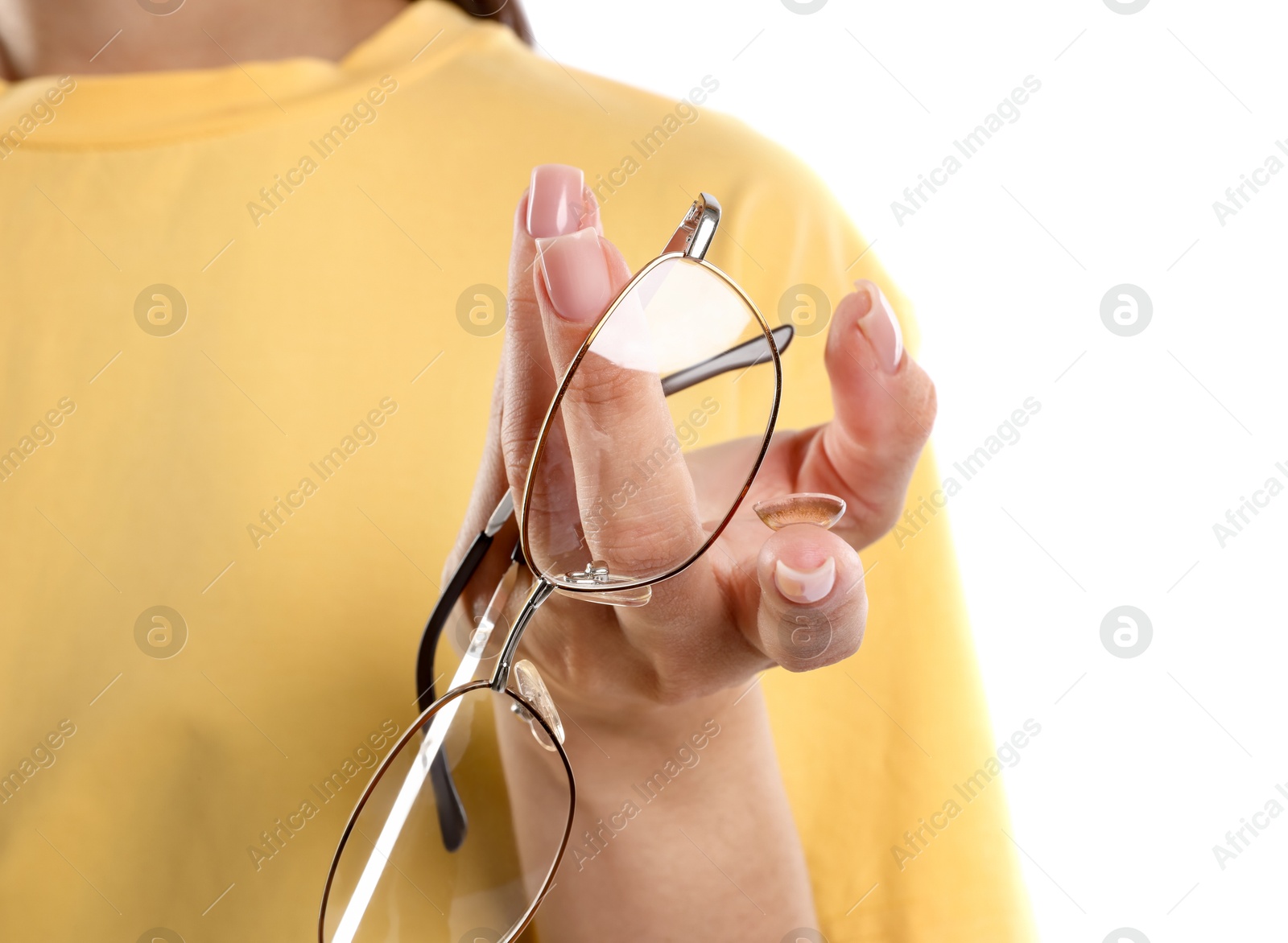 Photo of Woman choosing between glasses and contact lens on white background, closeup