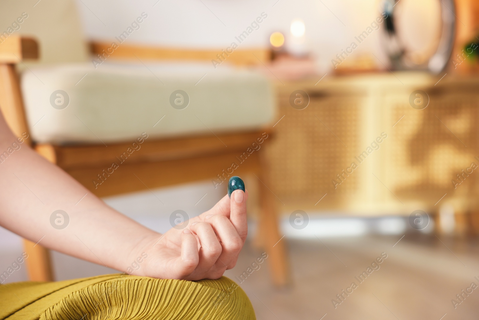 Photo of Woman with beautiful gemstone indoors, closeup. Space for text