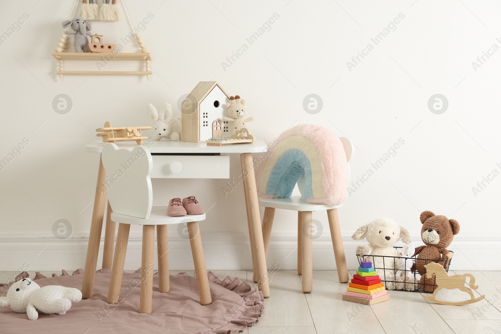 Photo of Different cute toys and furniture in child's room