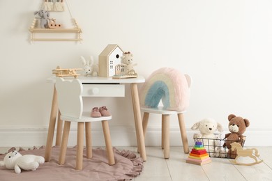 Photo of Different cute toys and furniture in child's room