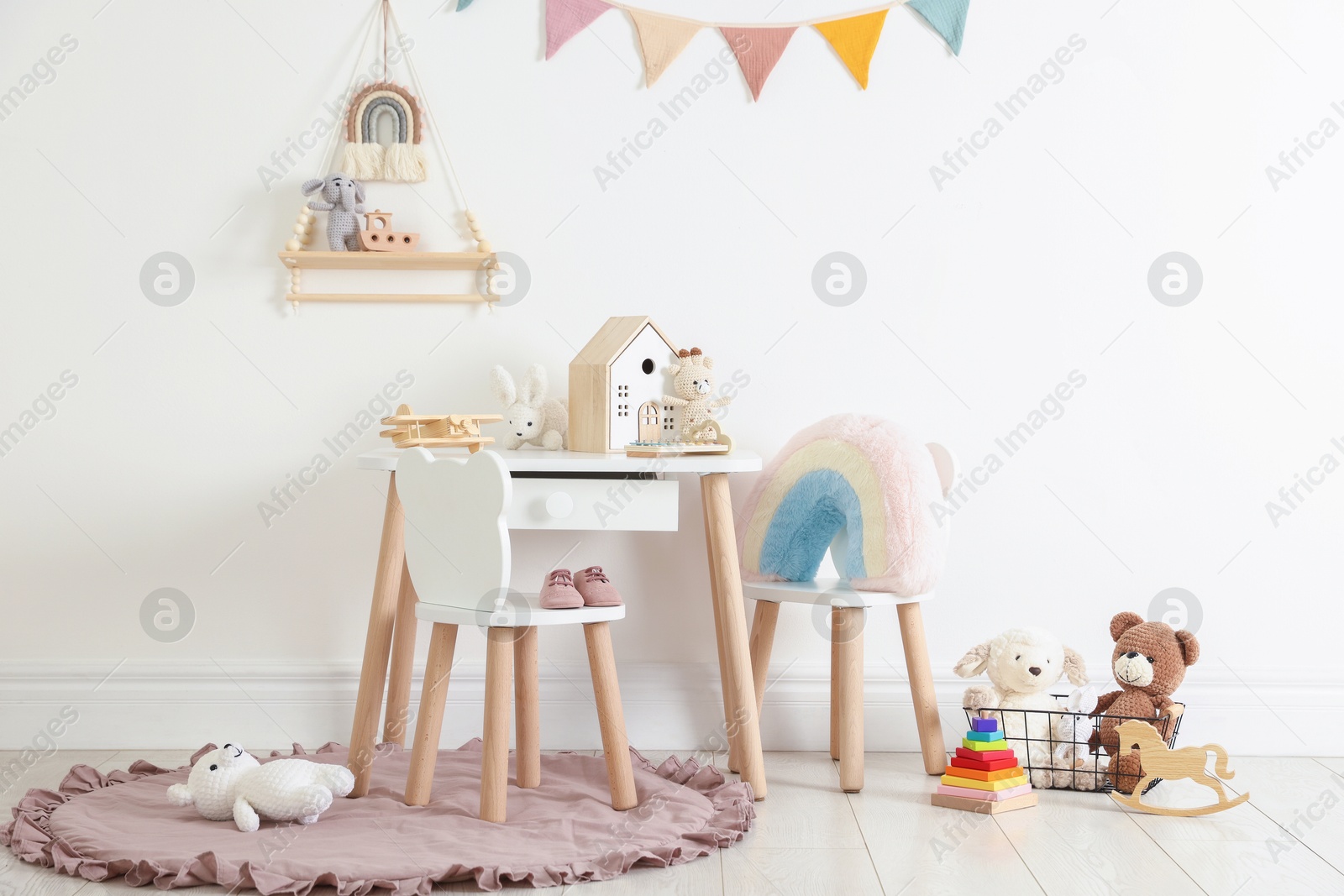 Photo of Different cute toys and furniture in child's room