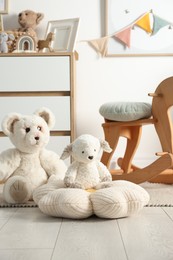 Photo of Different cute toys and furniture in child's room