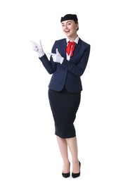 Photo of Beautiful stewardess showing something on white background