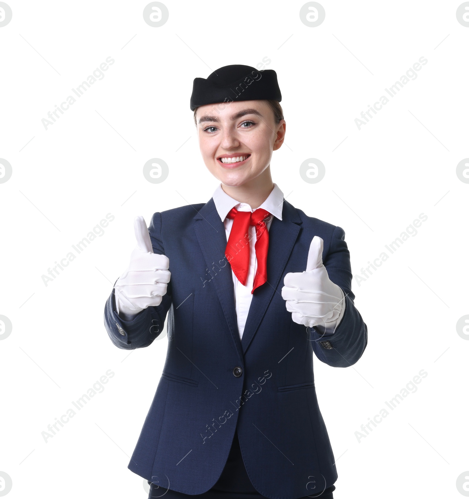 Photo of Beautiful stewardess showing thumbs ups on white background