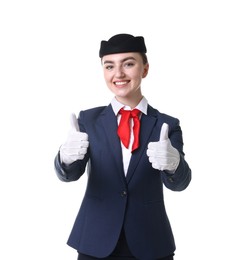 Photo of Beautiful stewardess showing thumbs ups on white background