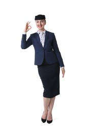 Photo of Charming stewardess showing okay gesture on white background