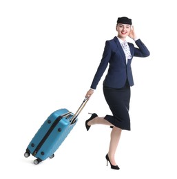 Photo of Positive stewardess with suitcase on white background