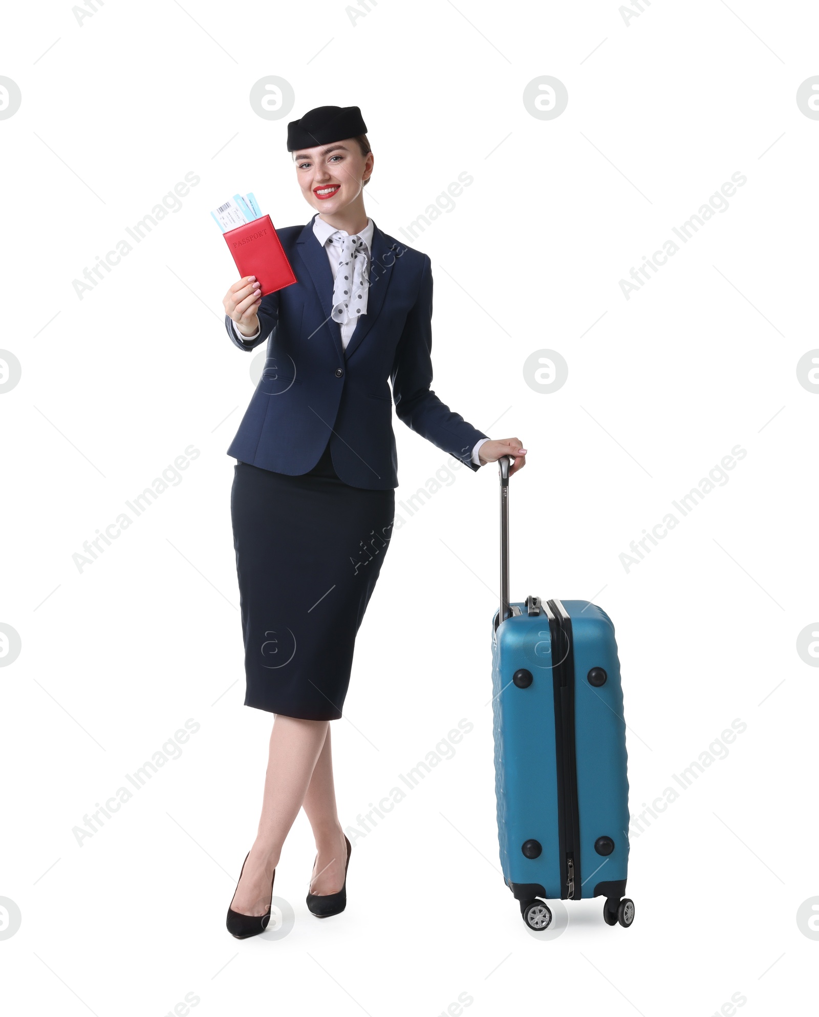 Photo of Positive stewardess with suitcase, passport and tickets on white background
