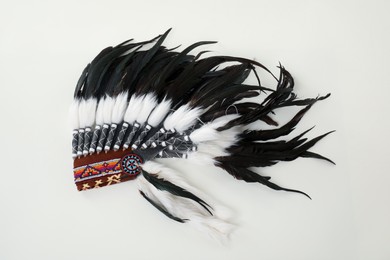 Photo of Traditional warbonnet (Native American chief headdress) isolated on white, top view