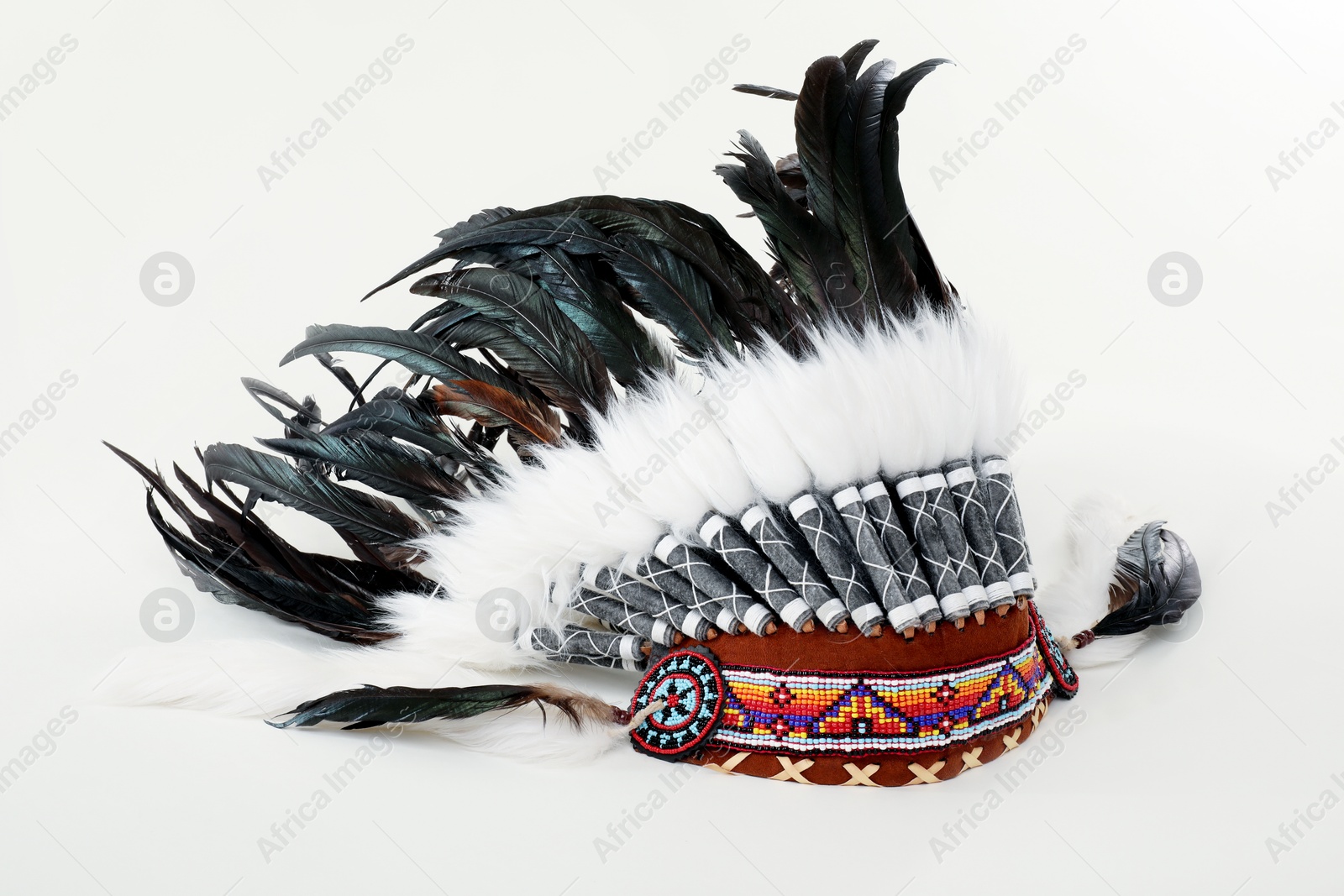 Traditional warbonnet (Native American chief headdress) isolated on white Photo of Traditional warbonnet (Native American chief headdress) isolated on white