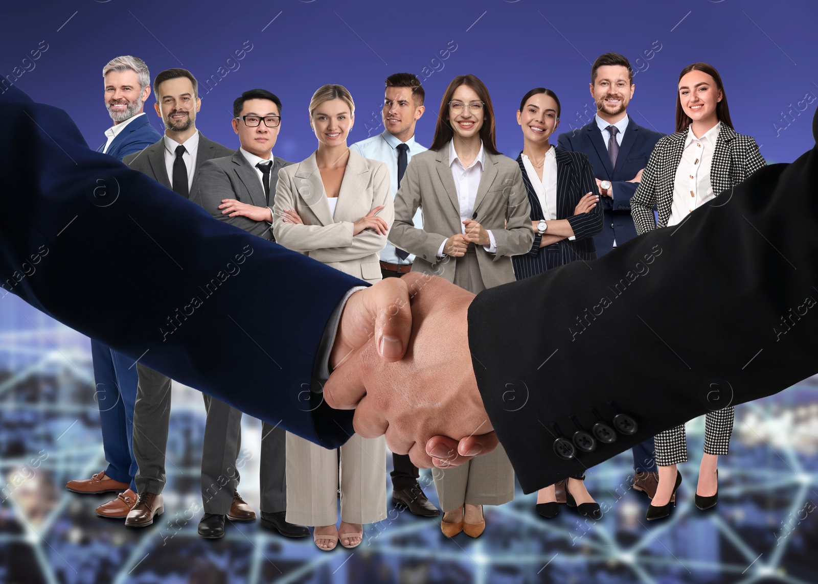 Image of Partners shaking hands against group of business people