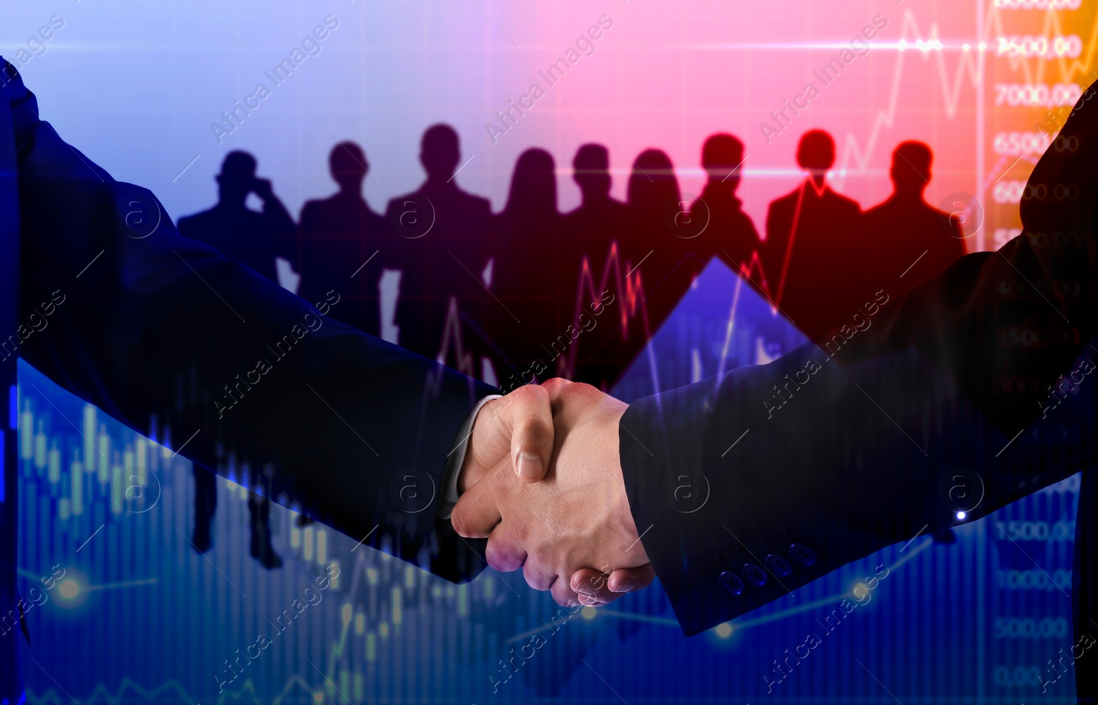 Image of Business partners shaking hands against silhouettes of people