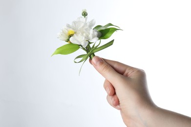 Photo of Woman with beautiful boutonniere on white background, closeup