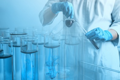 Image of Laboratory analysis. Scientist working with glassware, double exposure with test tubes