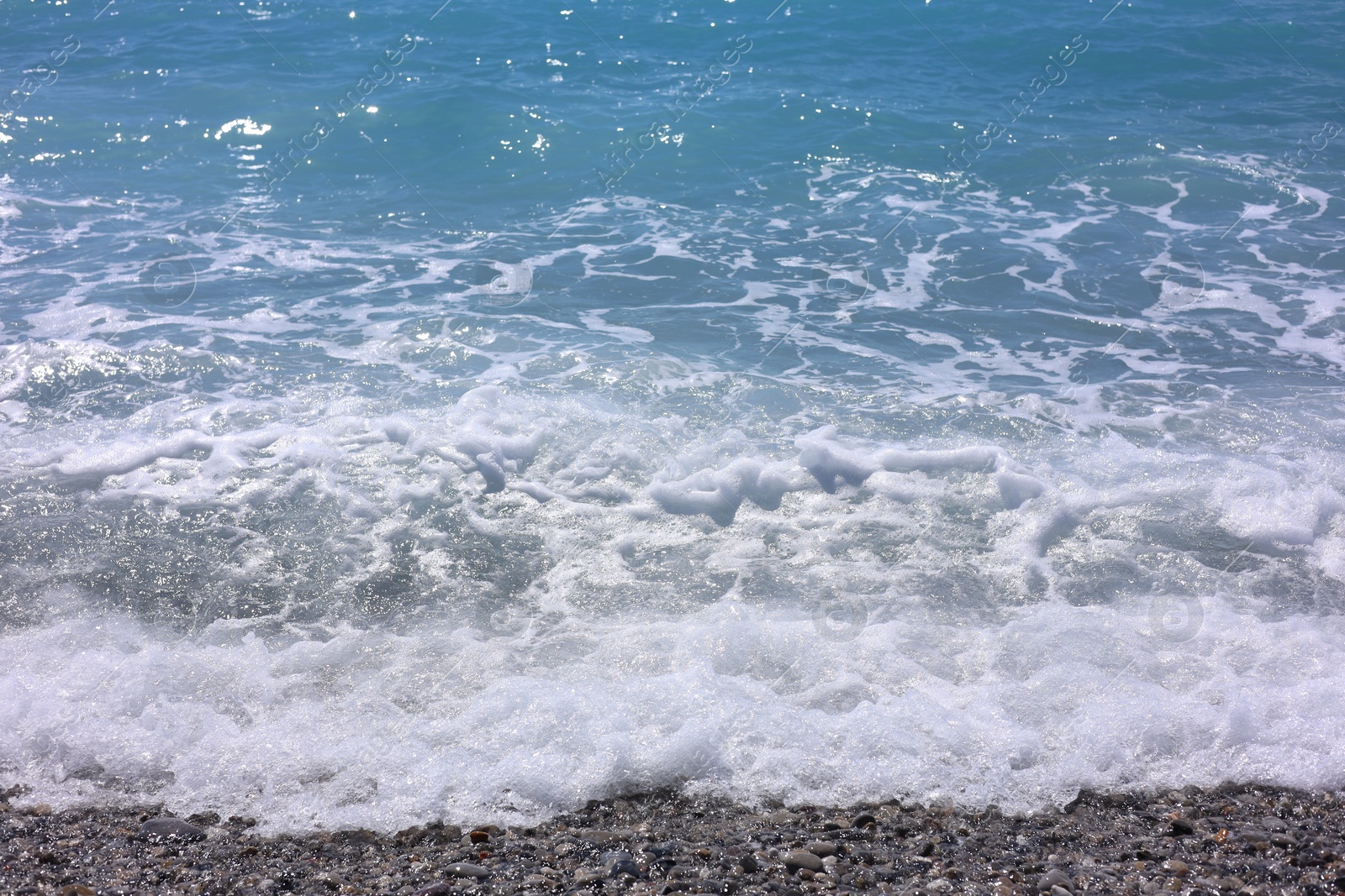 Photo of Beautiful view of wavy sea and pebbles