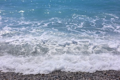Photo of Beautiful view of wavy sea and pebbles