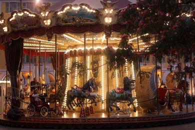 Photo of Nice, France - August 24, 2025: Beautiful illuminated carousel in amusement park