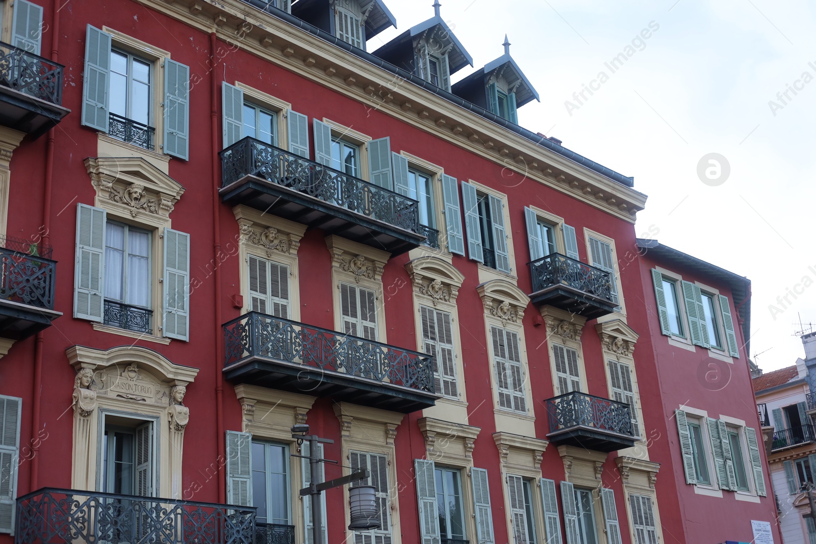 Nice, France - August 24, 2025: Beautiful building with windows in city, low angle view Photo of Nice, France - August 24, 2025: Beautiful building with windows in city, low angle view