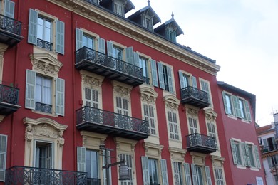 Photo of Nice, France - August 24, 2025: Beautiful building with windows in city, low angle view