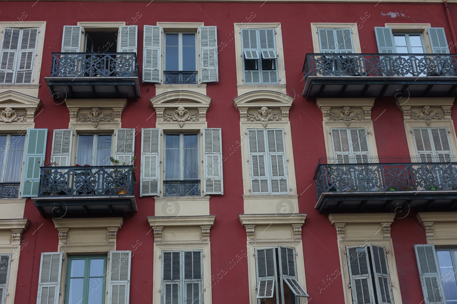Nice, France - August 24, 2025: Beautiful building with windows in city, low angle view Photo of Nice, France - August 24, 2025: Beautiful building with windows in city, low angle view