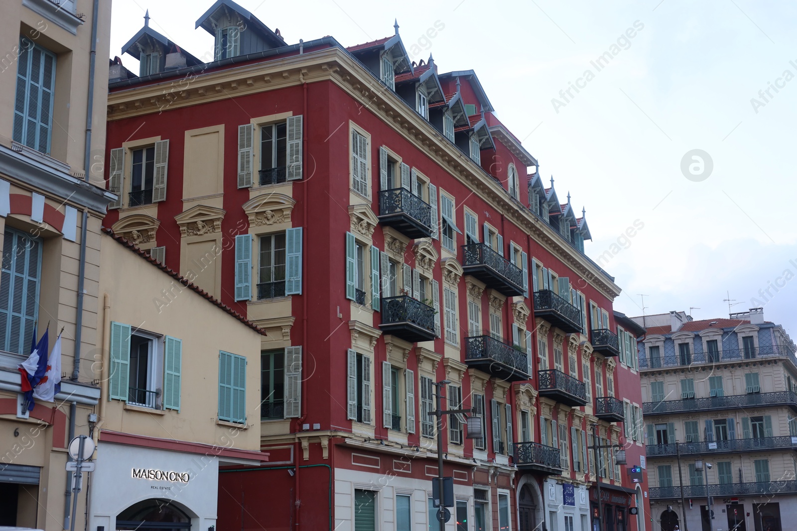 Photo of Nice, France - August 24, 2025: Beautiful buildings with windows in city, low angle view